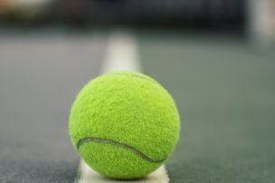 Green Tennis Ball on Court